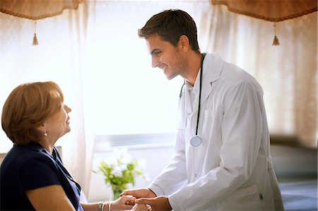 Senior woman talking to her doctor. Stock Photo - Premium Royalty-Free, Code: 6128-08780710