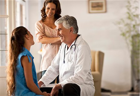 elderly patient and doctor - Young girl getting a checkup at the doctor's office. Stock Photo - Premium Royalty-Free, Code: 6128-08780715