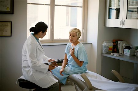 simsearch:600-03503186,k - Female doctor consulting with a patient after a medical examination in her office. Stock Photo - Premium Royalty-Free, Code: 6128-08798993