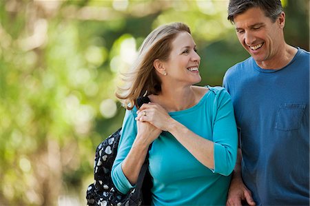 simsearch:6128-08738334,k - Happy middle aged couple walking in the park. Stock Photo - Premium Royalty-Free, Code: 6128-08799031