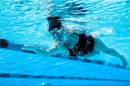 Female swimmer swimming the front crawl. Stock Photo - Premium Royalty-Free, Code: 6128-08728122