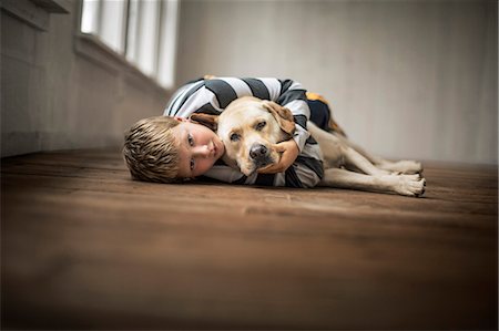 pictures of labrador dogs with people - Loving young boy hugging his dog. Stock Photo - Premium Royalty-Free, Code: 6128-08728227