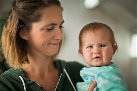 Happy mother holding her baby daughter. Stock Photo - Premium Royalty-Free, Code: 6128-08728301