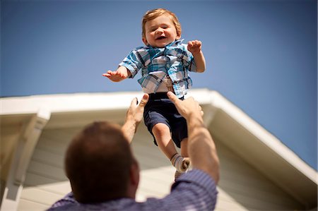 simsearch:700-06758135,k - Happy young boy being caught by his father. Stock Photo - Premium Royalty-Free, Code: 6128-08737799