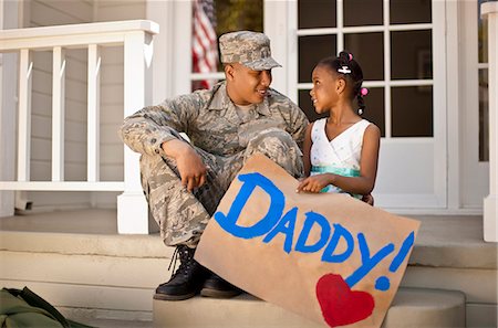 soldiers - Young girl and her father having a discussion on the front porch of their home. Stock Photo - Premium Royalty-Free, Code: 6128-08737848