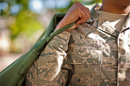 Duffel bag being carried by an army soldier. Stock Photo - Premium Royalty-Free, Code: 6128-08737826
