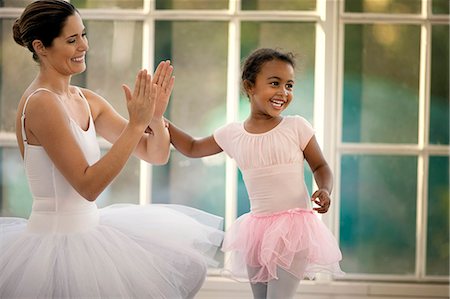 Mid adult woman bonding with her young daughter. Stock Photo - Premium Royalty-Free, Code: 6128-08737992