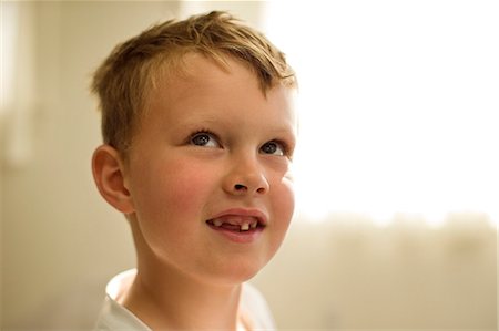 Portrait of a smiling young boy. Stock Photo - Premium Royalty-Free, Code: 6128-08738314