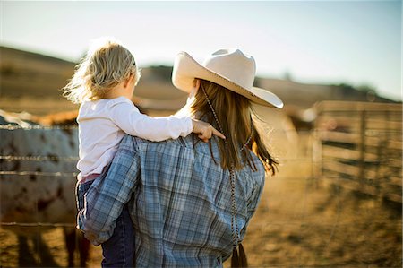 farmers family of three - Farmer's toddler out and about on the ranch. Stock Photo - Premium Royalty-Free, Code: 6128-08738560