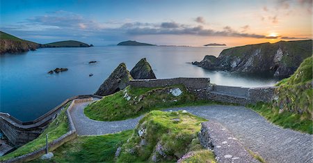 Dunquin pier (Dún Chaoin), Dingle peninsula, County Kerry, Munster province, Ireland, Europe. Panoramic view of the trail at sunset. Stock Photo - Premium Royalty-Free, Code: 6129-09044473
