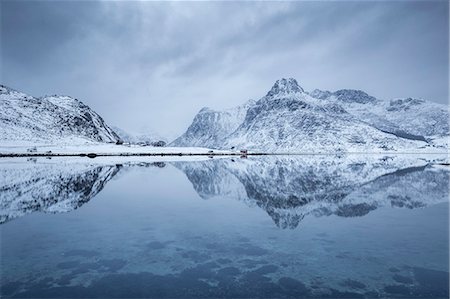 Perfect reflection of mountains and red house, Lofoten Islands, Norway Stock Photo - Premium Royalty-Free, Code: 6129-09045011
