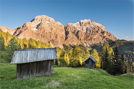 La Valle / Wengen, Alta Badia, Bolzano province, South Tyrol, Italy. Sunset on the pastures of Pra de Rit with the peaks Cima Nove / Neunerspitze and Cima Dieci / Zehnerspitze Stock Photo - Premium Royalty-Free, Code: 6129-09086899