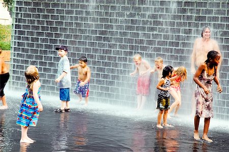shower kid - Group of children playing in water Stock Photo - Premium Royalty-Free, Code: 625-00805338