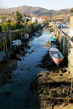 road landscape - High angle view of a canoe docked at a canal, Spain Stock Photo - Premium Royalty-Free, Code: 625-00805625