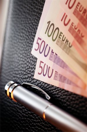 simsearch:625-00801281,k - Various Euro bank notes with pen on top of wallet, close-up Stock Photo - Premium Royalty-Free, Code: 625-00801152