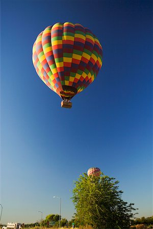 simsearch:625-00801301,k - Low angle view of a hot air balloon flying in the sky Stock Photo - Premium Royalty-Free, Code: 625-00801400