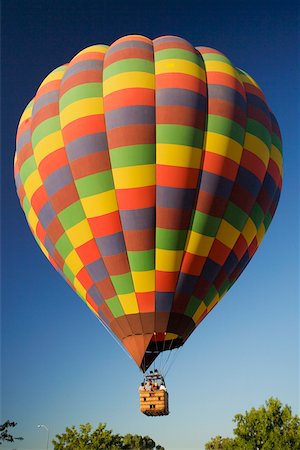simsearch:625-00801301,k - Low angle view of hot air balloon flying in the sky Stock Photo - Premium Royalty-Free, Code: 625-00801691