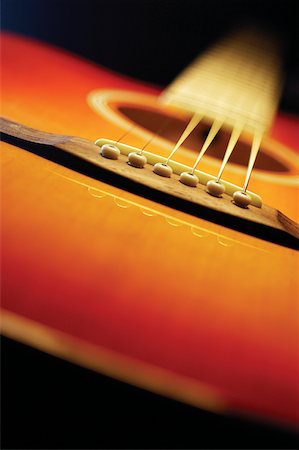Close-up of guitar, including bridge and strings Stock Photo - Premium Royalty-Free, Code: 625-00801910