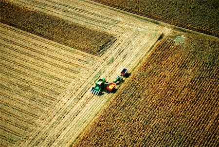 Aerial view of combine harvesting corn, Clinton county, OH Stock Photo - Premium Royalty-Free, Code: 625-00837410
