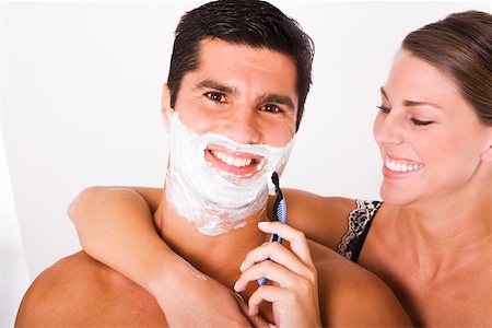 simsearch:625-00839074,k - Close-up of a young woman shaving a mid adult man Stock Photo - Premium Royalty-Free, Code: 625-00837594