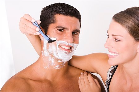 simsearch:625-00839074,k - Close-up of a young woman shaving a mid adult man Stock Photo - Premium Royalty-Free, Code: 625-00837642