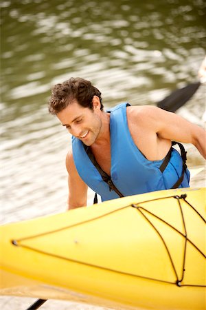 simsearch:625-00801301,k - High angle view of a mid adult man carrying a kayak and an oar Stock Photo - Premium Royalty-Free, Code: 625-00837702