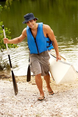simsearch:625-00801301,k - High angle view of a mid adult man carrying a kayak and an oar Stock Photo - Premium Royalty-Free, Code: 625-00837713