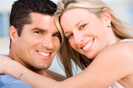 simsearch:625-00850507,k - Portrait of a young woman and a mid adult man smiling Stock Photo - Premium Royalty-Free, Code: 625-00838228