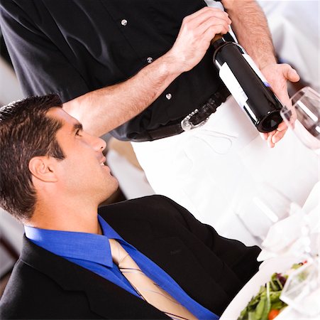 simsearch:625-00902698,k - Mid adult man sitting at a table with a waiter standing beside him Foto de stock - Sin royalties Premium, Código: 625-00838932