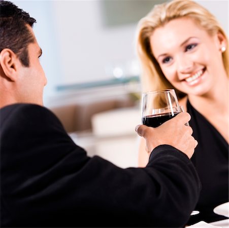 simsearch:625-00902698,k - Mid adult man holding a glass of red wine with a young woman sitting beside him Foto de stock - Sin royalties Premium, Código: 625-00838945