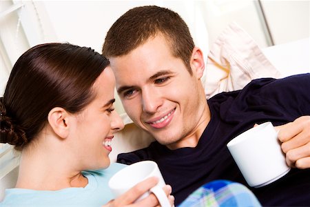 simsearch:625-00839074,k - Close-up of a young couple holding coffee cups Stock Photo - Premium Royalty-Free, Code: 625-00839064