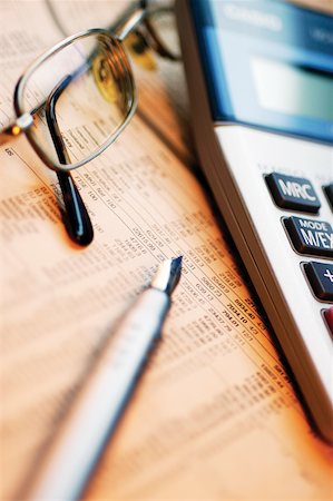 simsearch:625-00840035,k - Close-up of a pen with eyeglasses and a calculator on a financial newspaper Stock Photo - Premium Royalty-Free, Code: 625-00839918