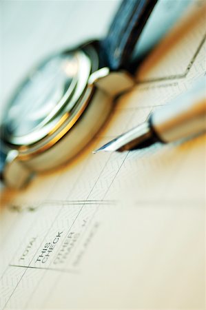 simsearch:625-00840035,k - Close-up of a fountain pen and a wristwatch on a bank deposit slip Stock Photo - Premium Royalty-Free, Code: 625-00839935
