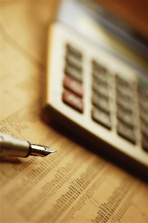 simsearch:625-00840035,k - Close-up of a pen and a calculator on a financial newspaper Stock Photo - Premium Royalty-Free, Code: 625-00839931