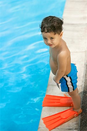 simsearch:625-01748893,k - High angle view of a boy standing by the pool Stock Photo - Premium Royalty-Free, Code: 625-00848945