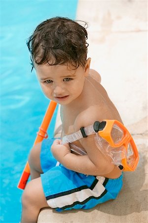 simsearch:625-01748893,k - High angle view of a boy holding snorkel sitting by the pool Stock Photo - Premium Royalty-Free, Code: 625-00849116