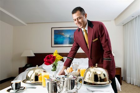 room service - Waiter serving food Stock Photo - Premium Royalty-Free, Code: 625-00849305