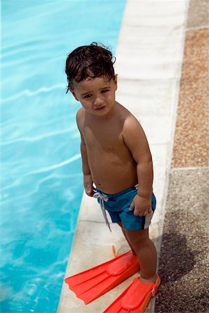 simsearch:625-01748893,k - High angle view of a boy standing by the pool Stock Photo - Premium Royalty-Free, Code: 625-00849359