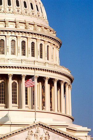 simsearch:625-00840464,k - Low angle view of a flag fluttering on a government building, Capitol Building, Washington DC, USA Stock Photo - Premium Royalty-Free, Code: 625-00840479