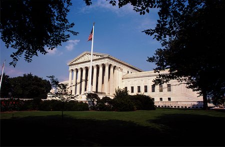 simsearch:625-00840464,k - Low angle view of an American flag in front of a government building, US Supreme Court, Washington DC, USA Stock Photo - Premium Royalty-Free, Code: 625-00840506