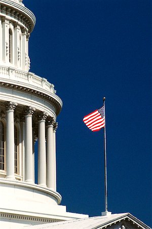 simsearch:625-00840464,k - Low angle view of an American flag fluttering on a government building, Capitol Building, Washington DC, USA Stock Photo - Premium Royalty-Free, Code: 625-00840577