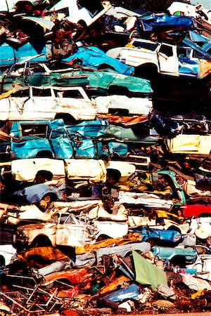 Close-up of a heap of cars in a junkyard Stock Photo - Premium Royalty-Free, Code: 625-00840617