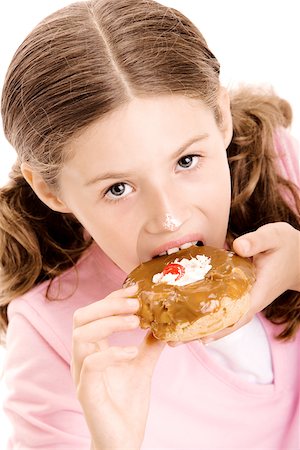 simsearch:625-01250196,k - Portrait of a girl eating a donut Stock Photo - Premium Royalty-Free, Code: 625-00841184