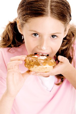 simsearch:625-01250196,k - Portrait of a girl eating a donut Stock Photo - Premium Royalty-Free, Code: 625-00841185