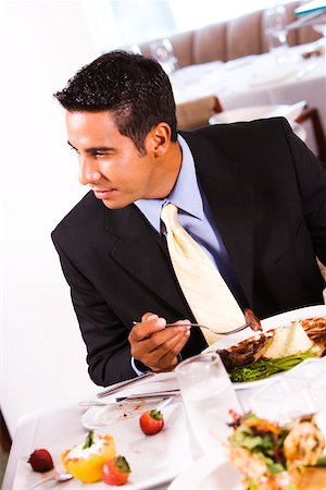 simsearch:640-01350815,k - Close-up of a businessman eating Stock Photo - Premium Royalty-Free, Code: 625-00842567