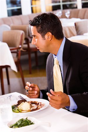 simsearch:640-01350815,k - Close-up of a businessman sitting at a table Stock Photo - Premium Royalty-Free, Code: 625-00842569