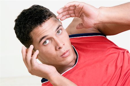 six-pack - Portrait of a young man doing sit ups Stock Photo - Premium Royalty-Free, Code: 625-00851215