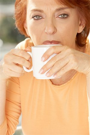 Portrait of a senior woman drinking coffee Stock Photo - Premium Royalty-Free, Code: 625-00901934