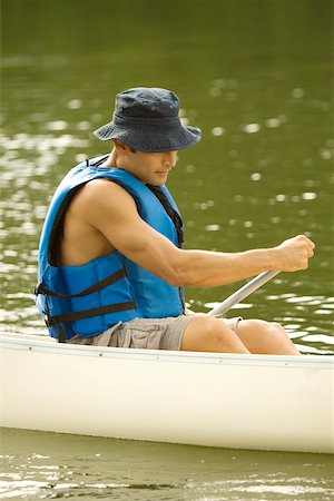 simsearch:625-00805928,k - Side profile of a mid adult man boating in a river Stock Photo - Premium Royalty-Free, Code: 625-00902663