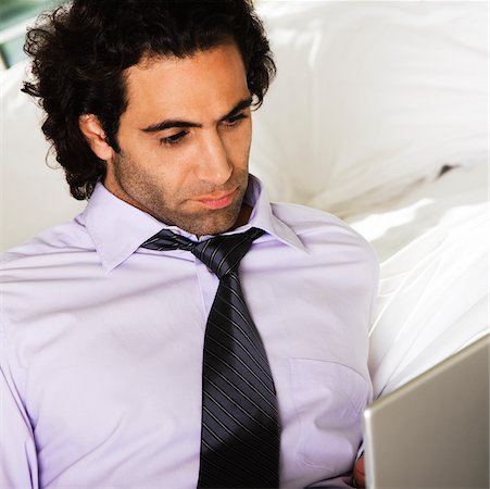 simsearch:625-00801205,k - Close-up of a mid adult man using a laptop Stock Photo - Premium Royalty-Free, Code: 625-00902689